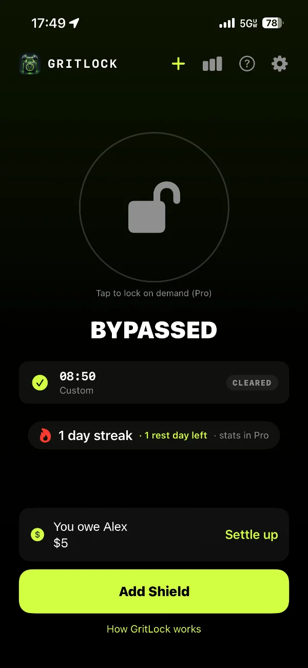 Grit-Lock home screen: a cleared shield, a 1 day streak with 1 rest day left, and a breaking fee owed with a Settle up button